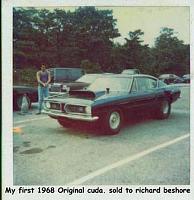 Click image for larger version

Name:	1968 black cuda.jpg
Views:	533
Size:	49.3 KB
ID:	2345