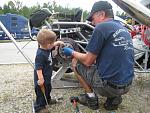 Tyler helping Grandpa with the Brakes......Is this a good idea?