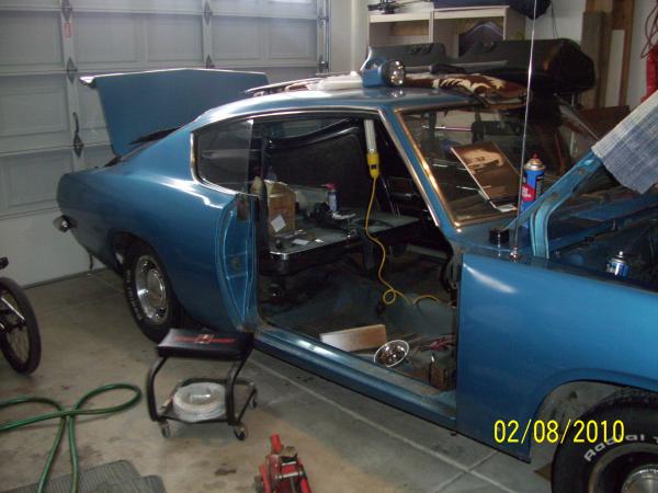 replacing passenger door which was from a '68. original Jamaica Blue (B7) cuda w/Deluxe X9 interior. this car was painted Silver by the original owner(?) after hitting something on the passenger side in 1970