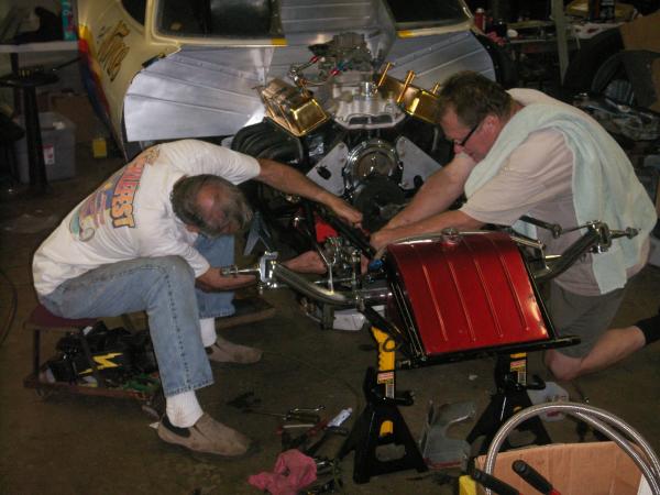 Boogie Scott (left) and Raymond Rupert working on former Ricky and Leo Klarr altered trying to get it ready for the Bowling Green Hot Rod Reunion this year.